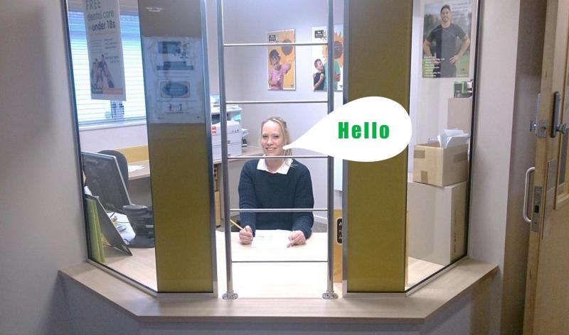 Photo of a person sitting at the dental clinic reception