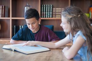 two children doing schoolwork 