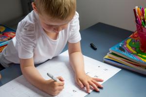 young child doing homework